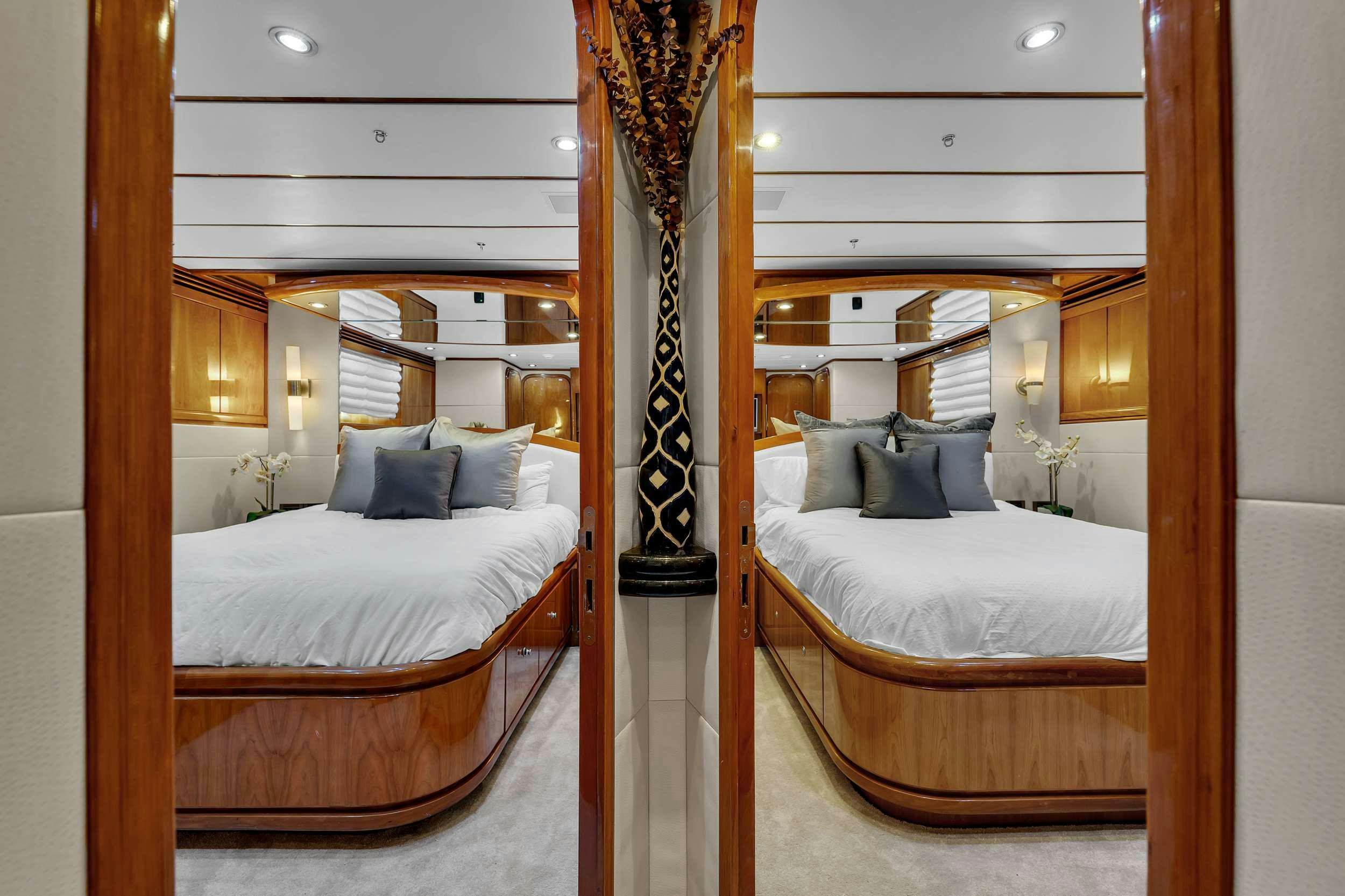 a room with a bed and a lamp aboard DREAM ON Yacht for Charter