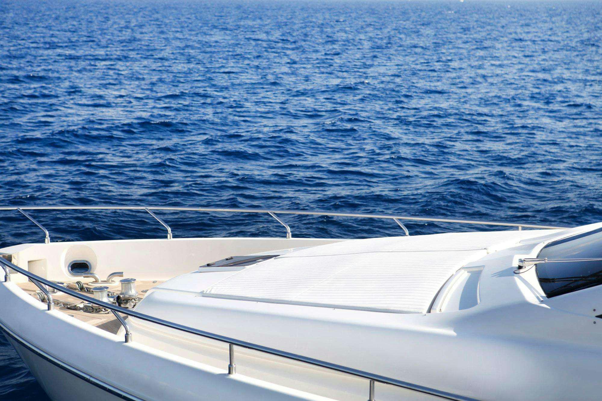a white boat in the water aboard BIOHAX Yacht for Charter