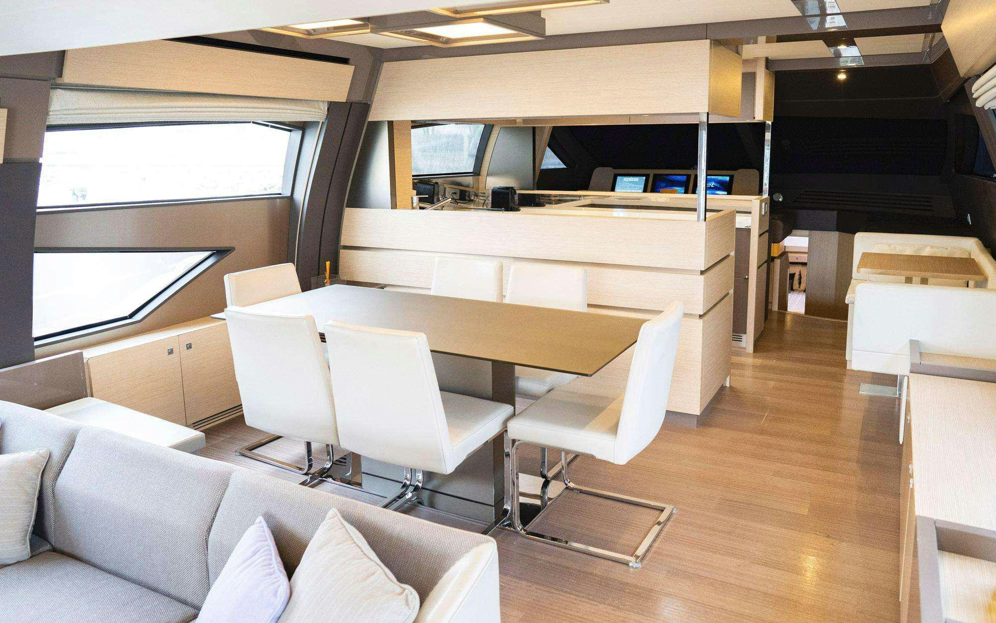 a room with a desk and chairs aboard BIOHAX Yacht for Charter