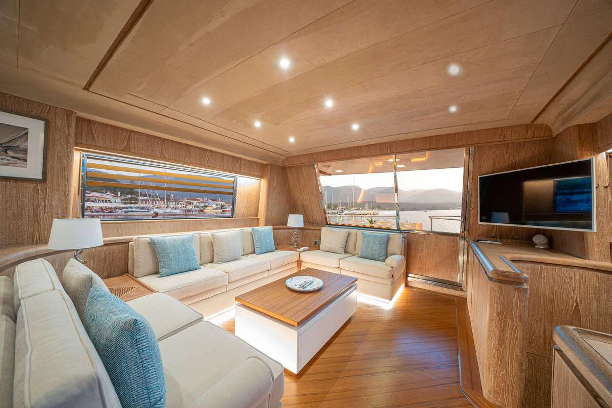 a living room with a large window aboard OPERA Yacht for Charter