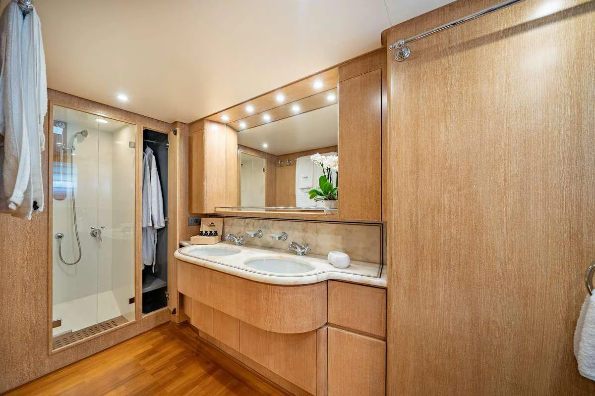 a bathroom with a large mirror aboard OPERA Yacht for Charter