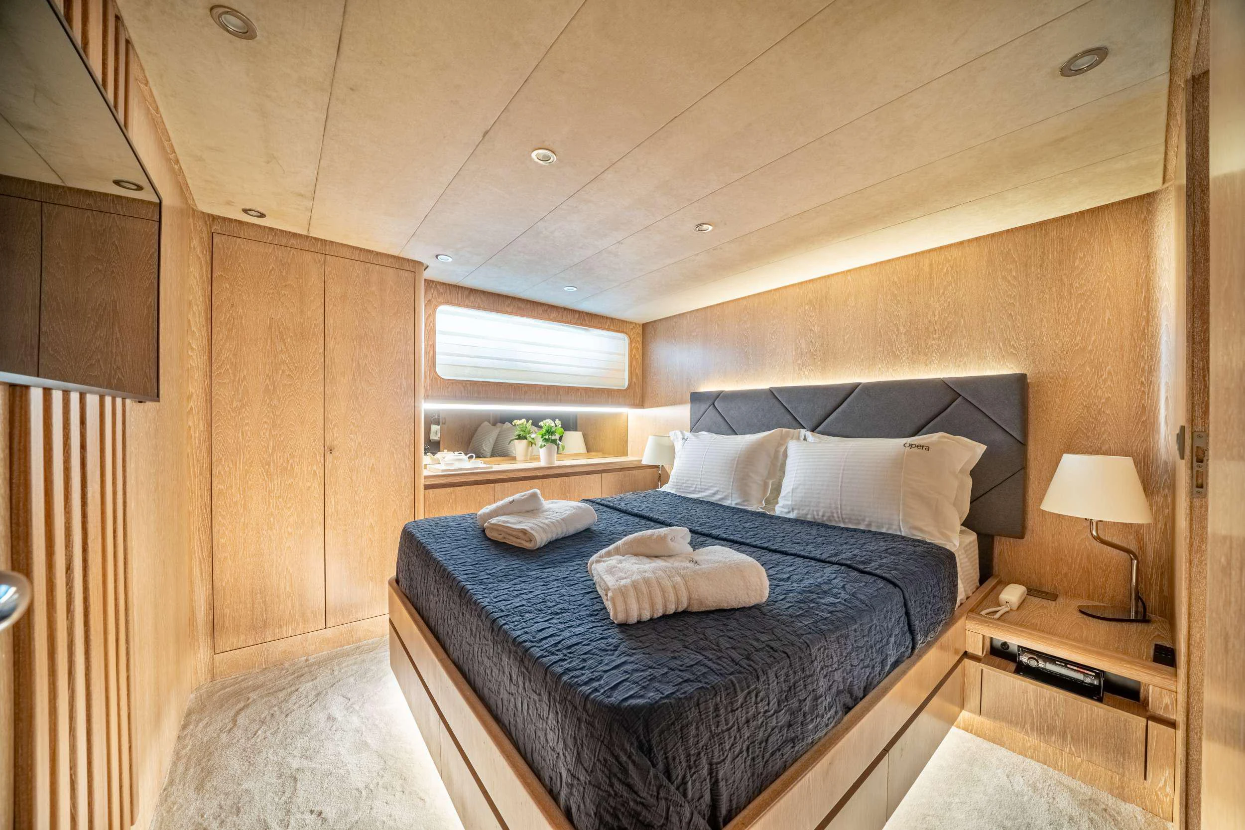 a bed in a room aboard OPERA Yacht for Charter