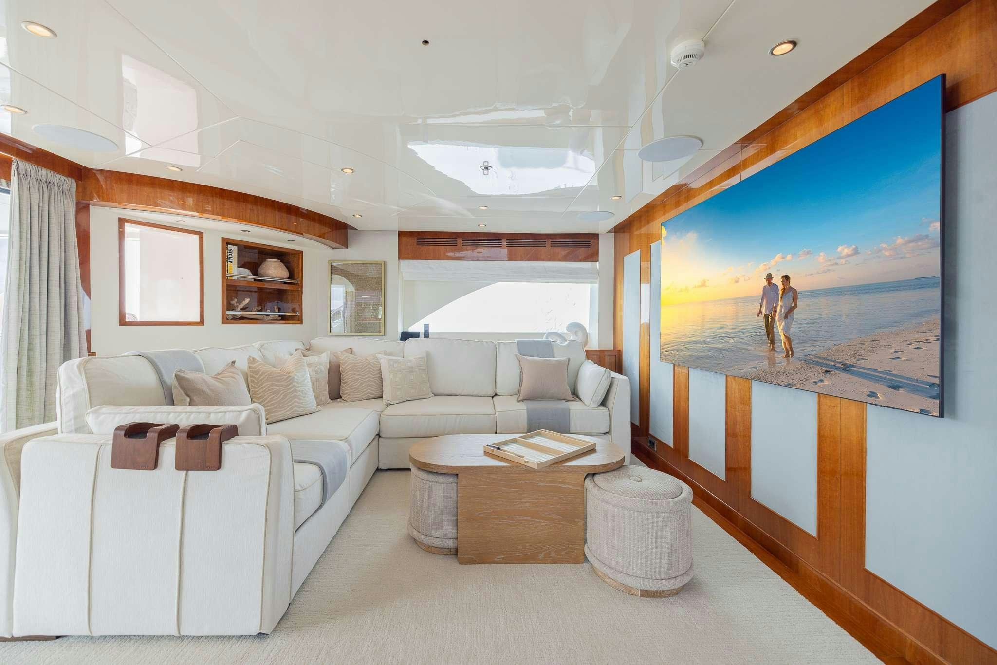 a living room with a large mirror aboard STAY SALTY Yacht for Charter