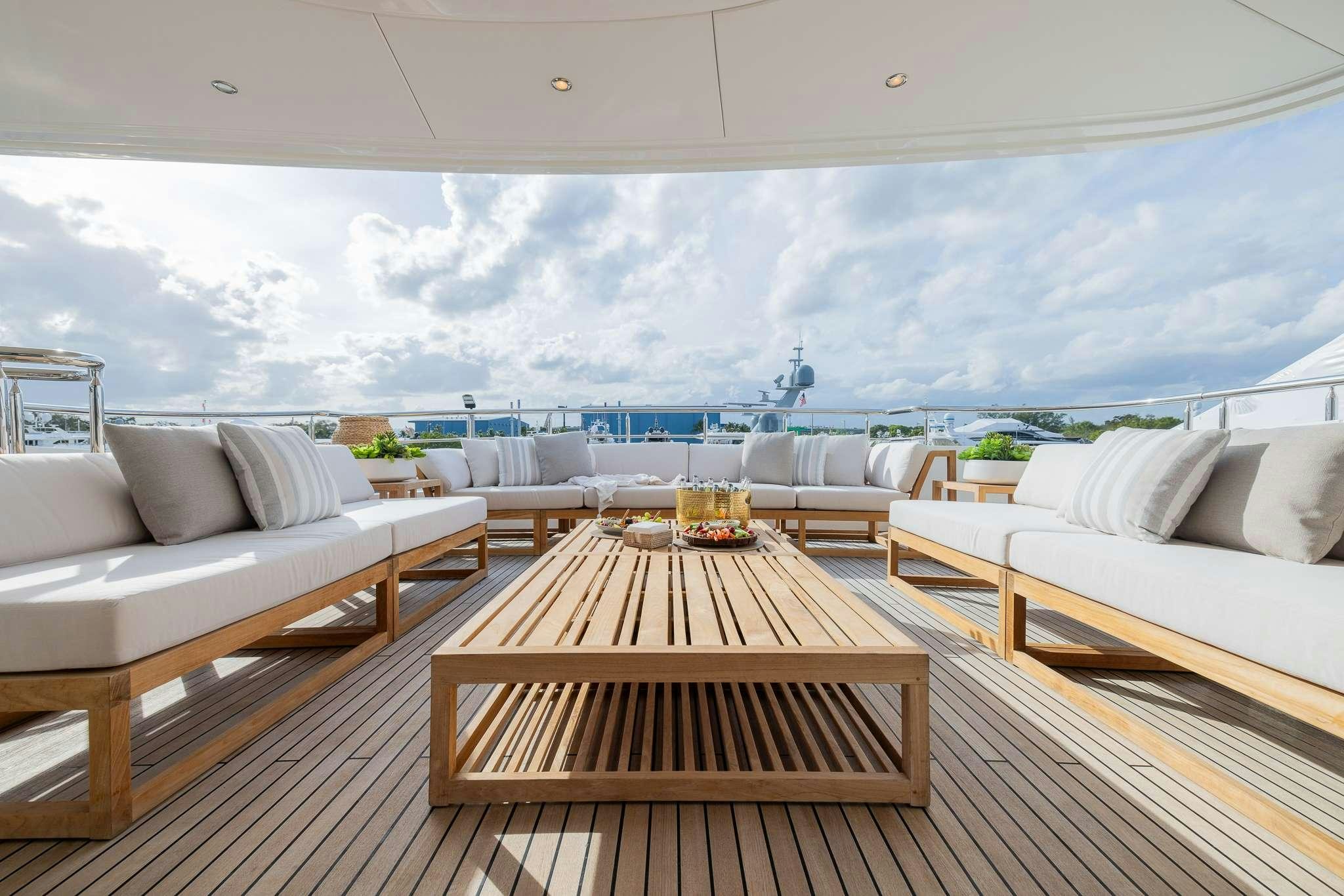 a room with a table and chairs aboard STAY SALTY Yacht for Charter