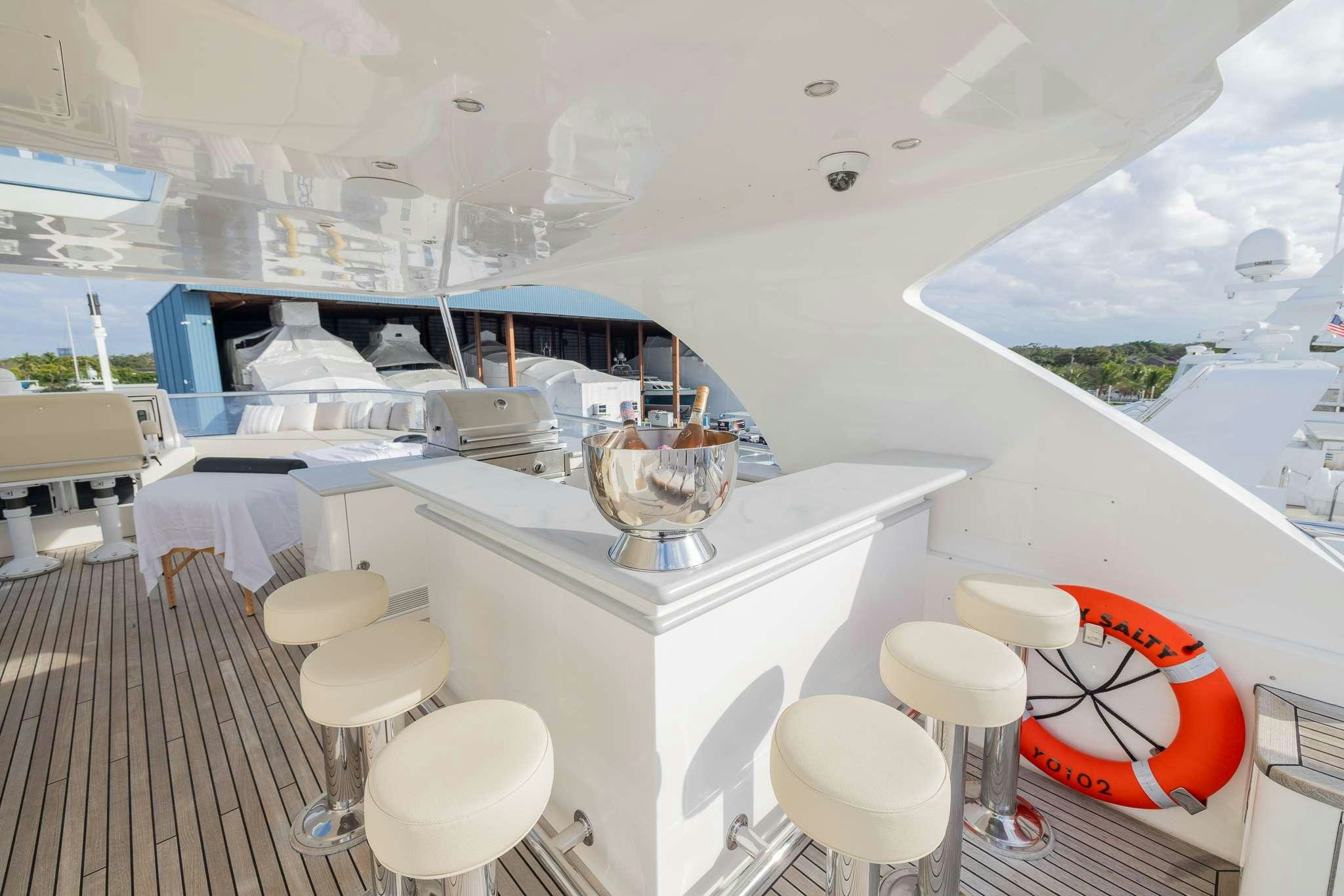 a room with a table and chairs aboard STAY SALTY Yacht for Charter