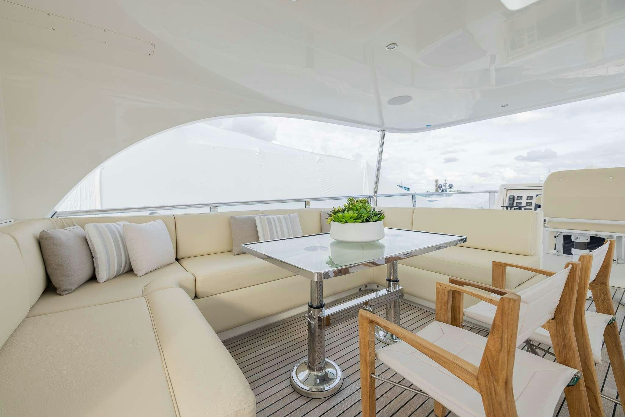 a room with a table and chairs aboard STAY SALTY Yacht for Charter