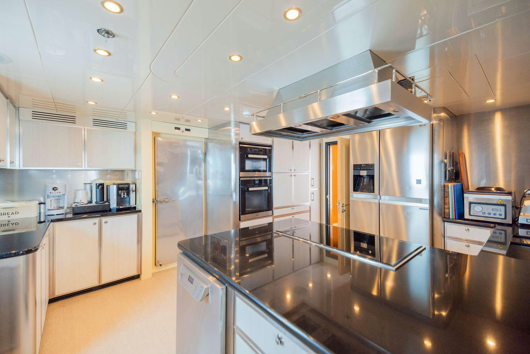 a kitchen with stainless steel appliances aboard STAY SALTY Yacht for Charter