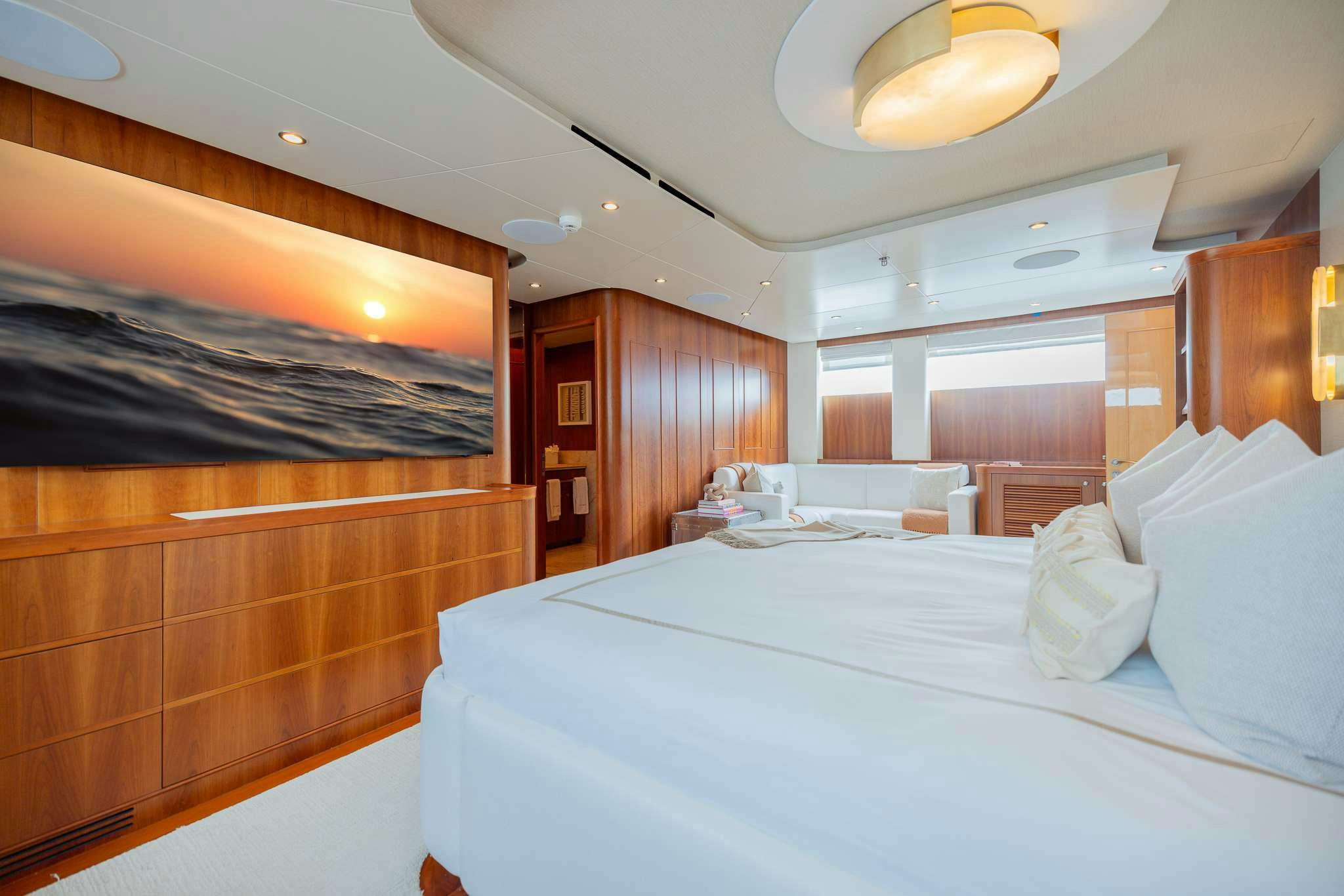 a room with a bed and a large window aboard STAY SALTY Yacht for Charter