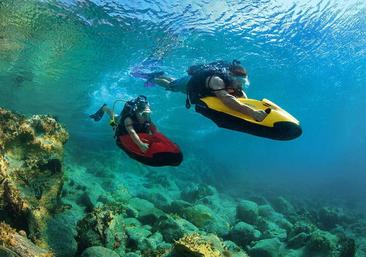a man and a woman in a kayak in a body of water aboard HALCYON Yacht for Charter