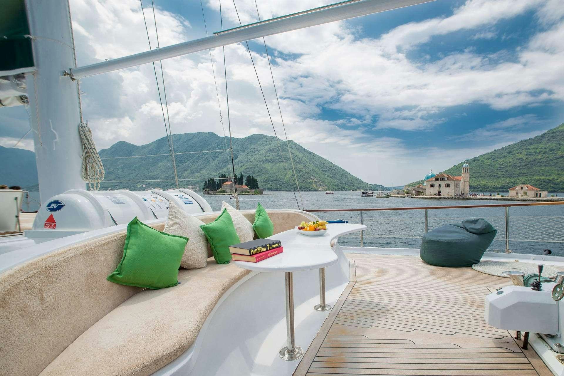 a room with a table and chairs aboard SADRI USTA Yacht for Charter