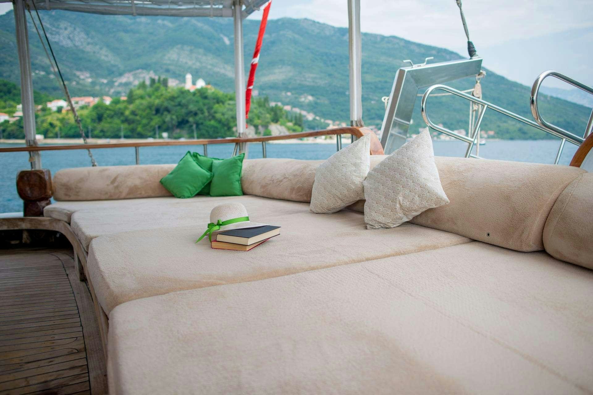 a couch with pillows and pillows aboard SADRI USTA Yacht for Charter