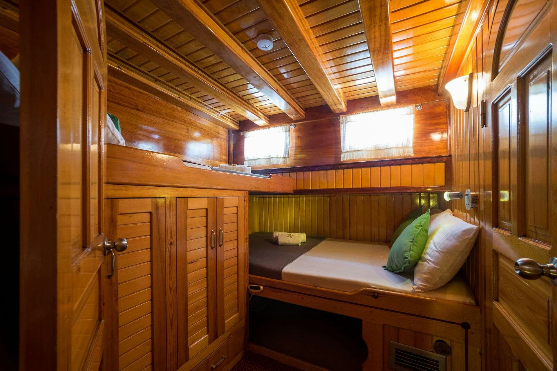 a bed in a room aboard SADRI USTA Yacht for Charter