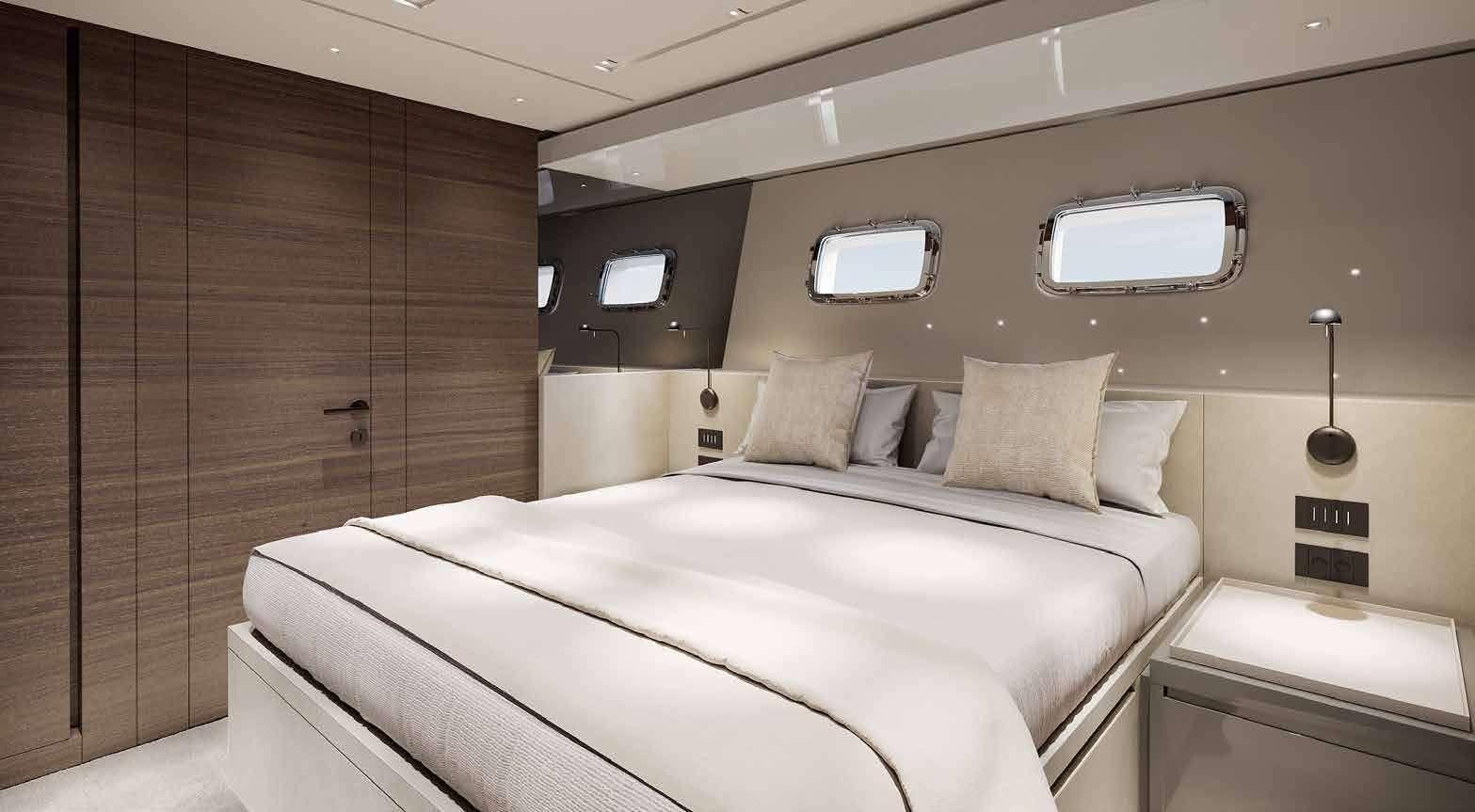 a room with a bed and a television aboard ASTRIMARE Yacht for Charter