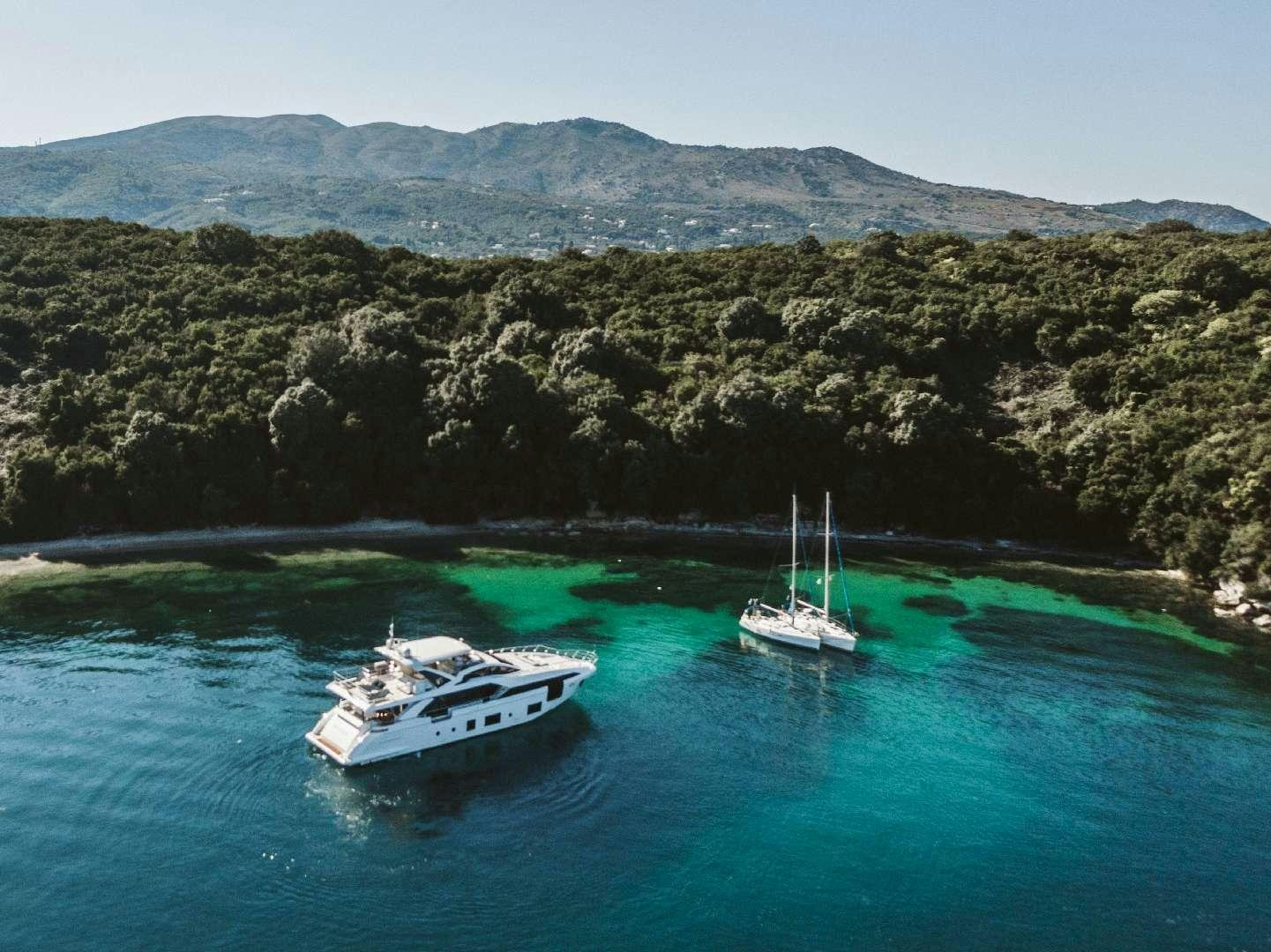 a couple of boats in the water aboard AGIO Yacht for Charter