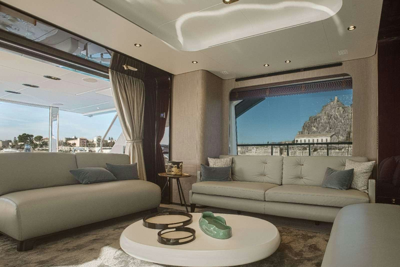 a living room with a couch and a table aboard AGIO Yacht for Charter