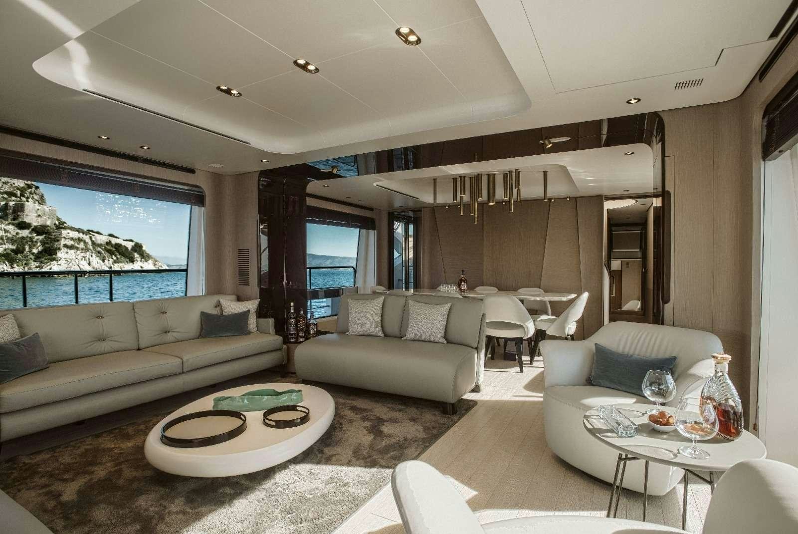 a living room with a large window aboard AGIO Yacht for Charter