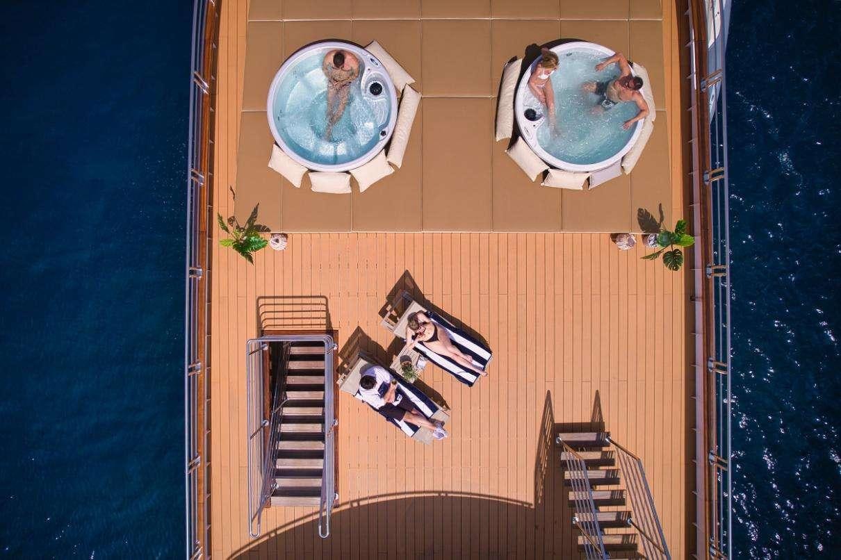a door with a bird statue on it aboard SYMPHONY Yacht for Charter