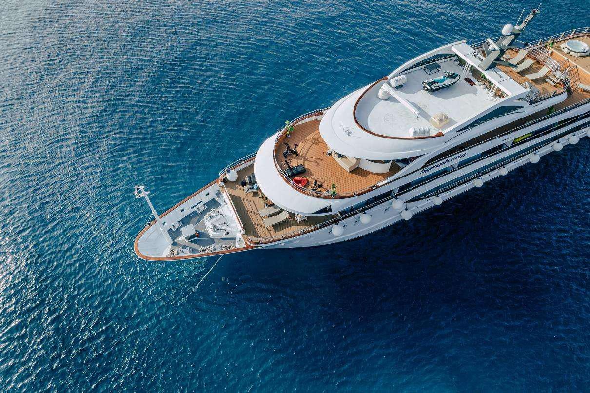 a couple of boats in the water aboard SYMPHONY Yacht for Charter