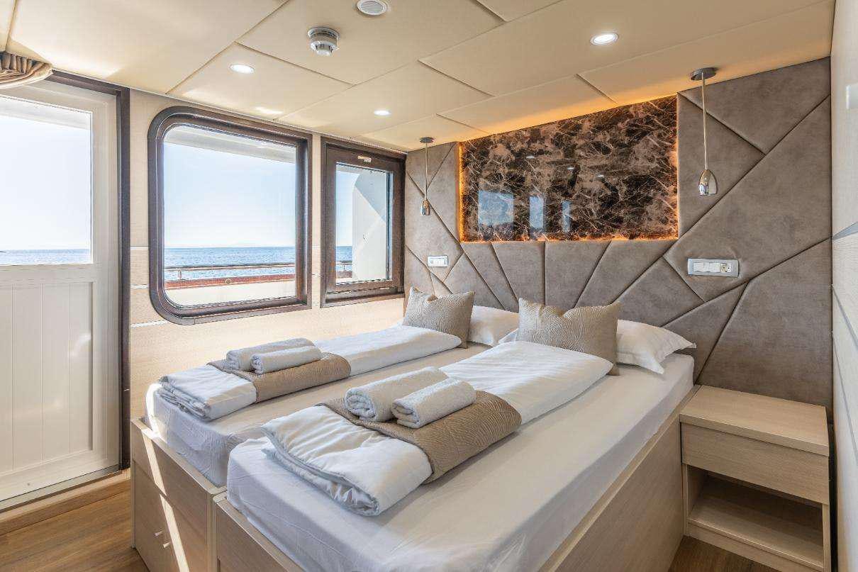 a bed in a room aboard SYMPHONY Yacht for Charter