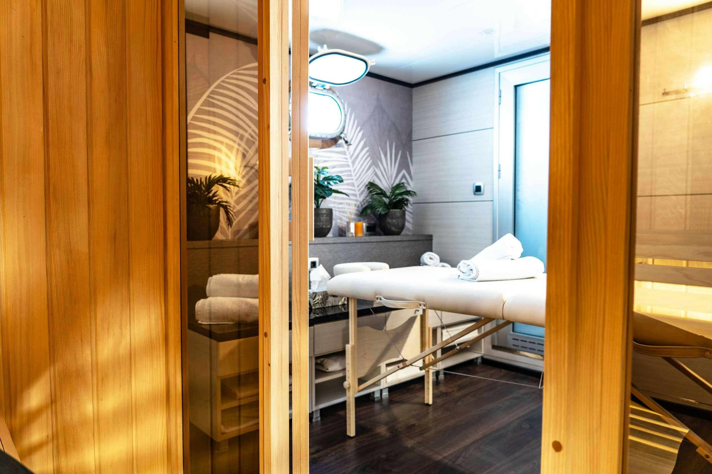 a room with a bed and a mirror aboard ARETHA Yacht for Charter