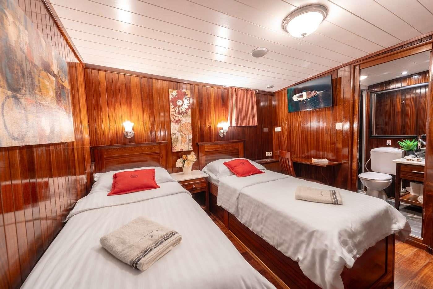 a room with two beds aboard CESARICA Yacht for Charter