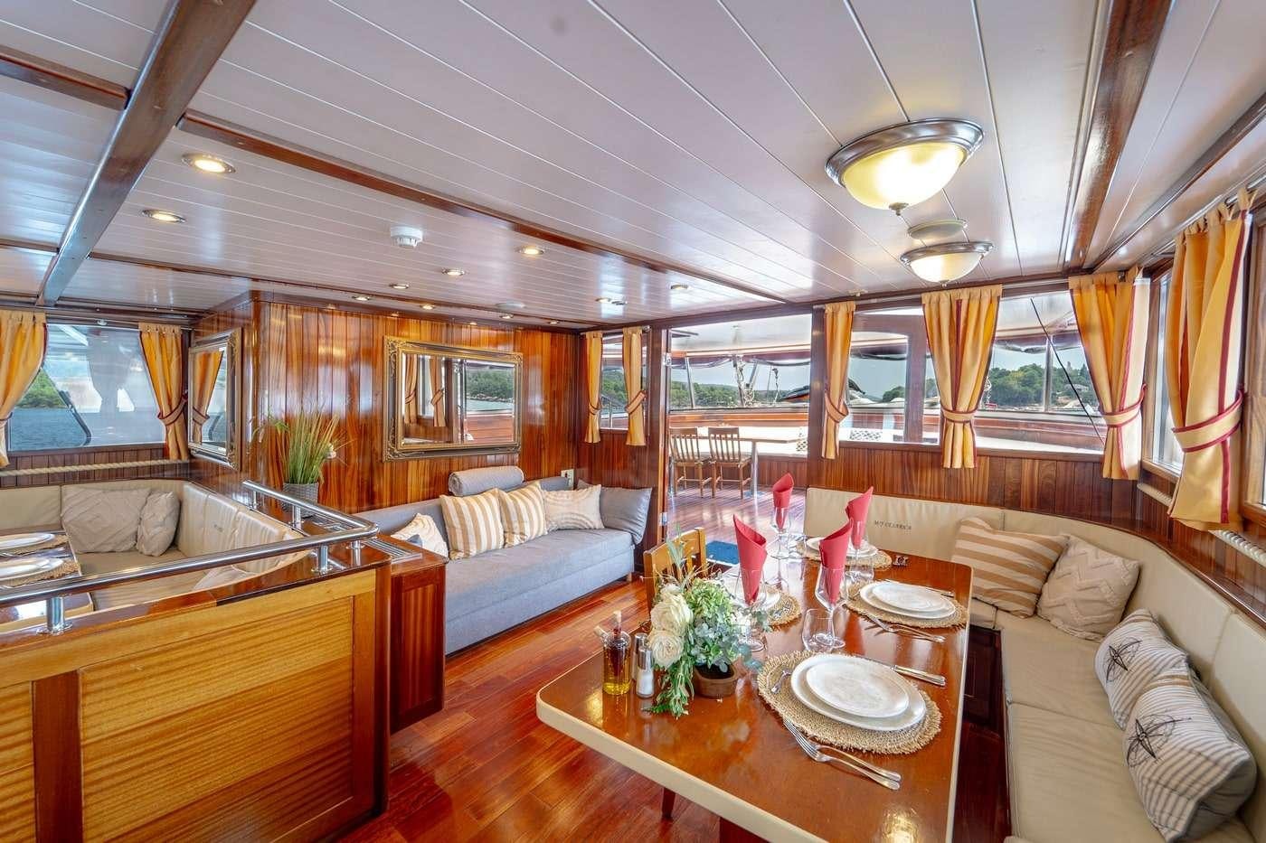 a large living room with a large window aboard CESARICA Yacht for Charter