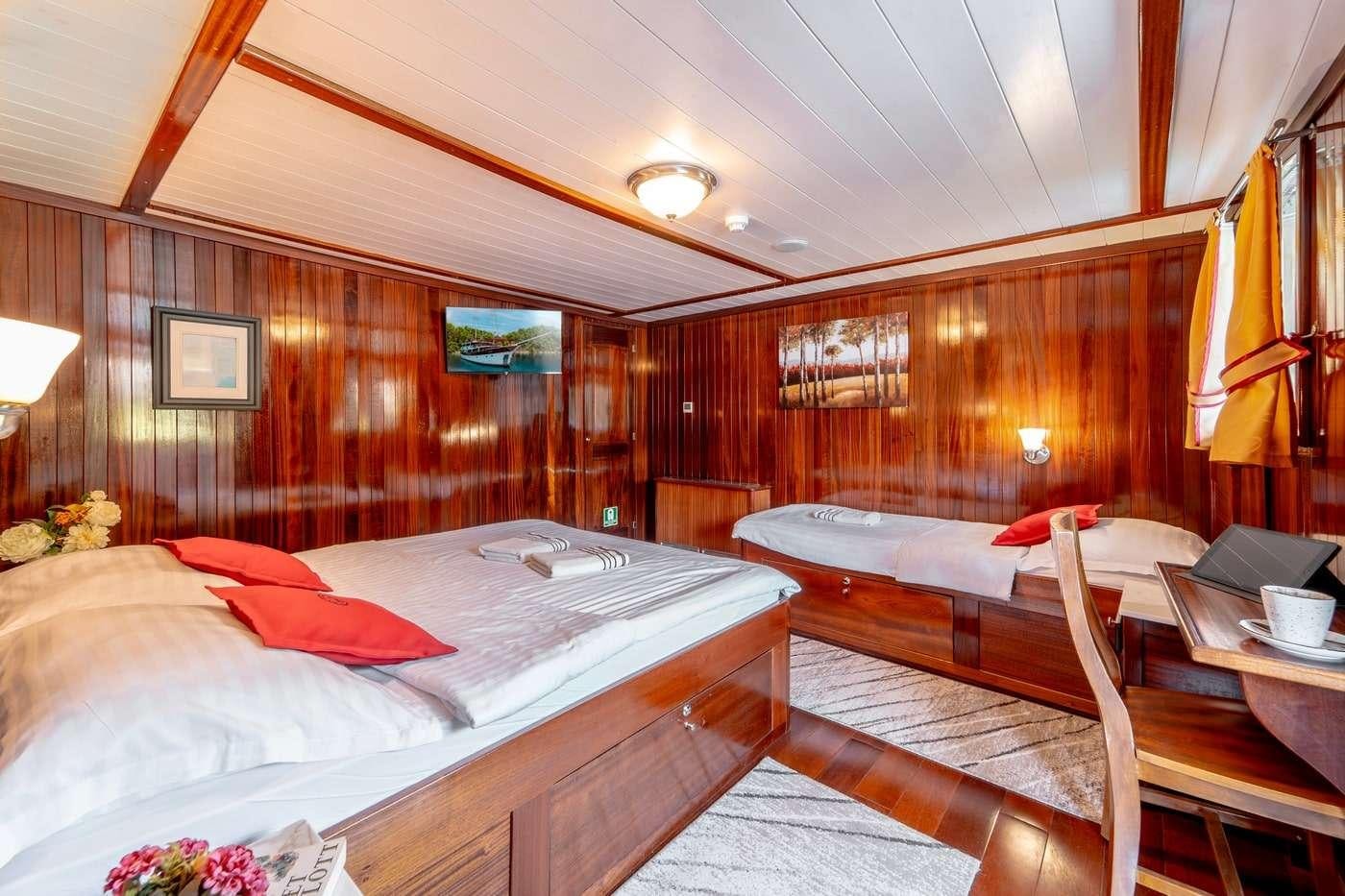 a room with two beds aboard CESARICA Yacht for Charter