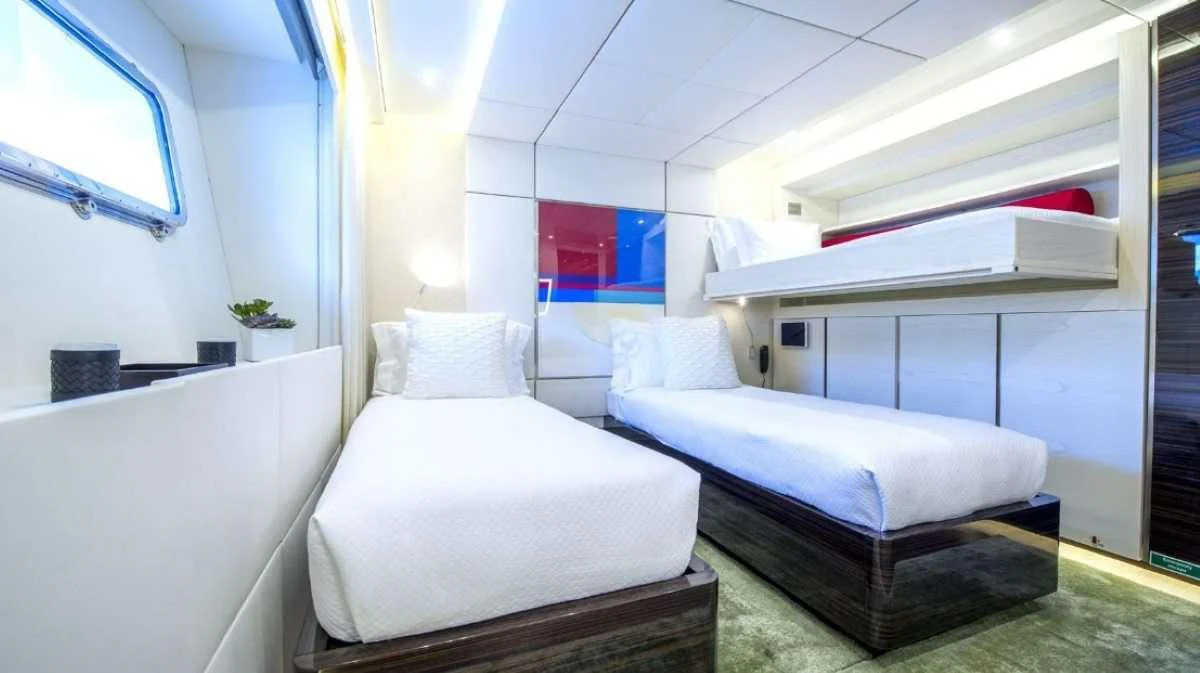 a room with two beds aboard AXIOS Yacht for Charter