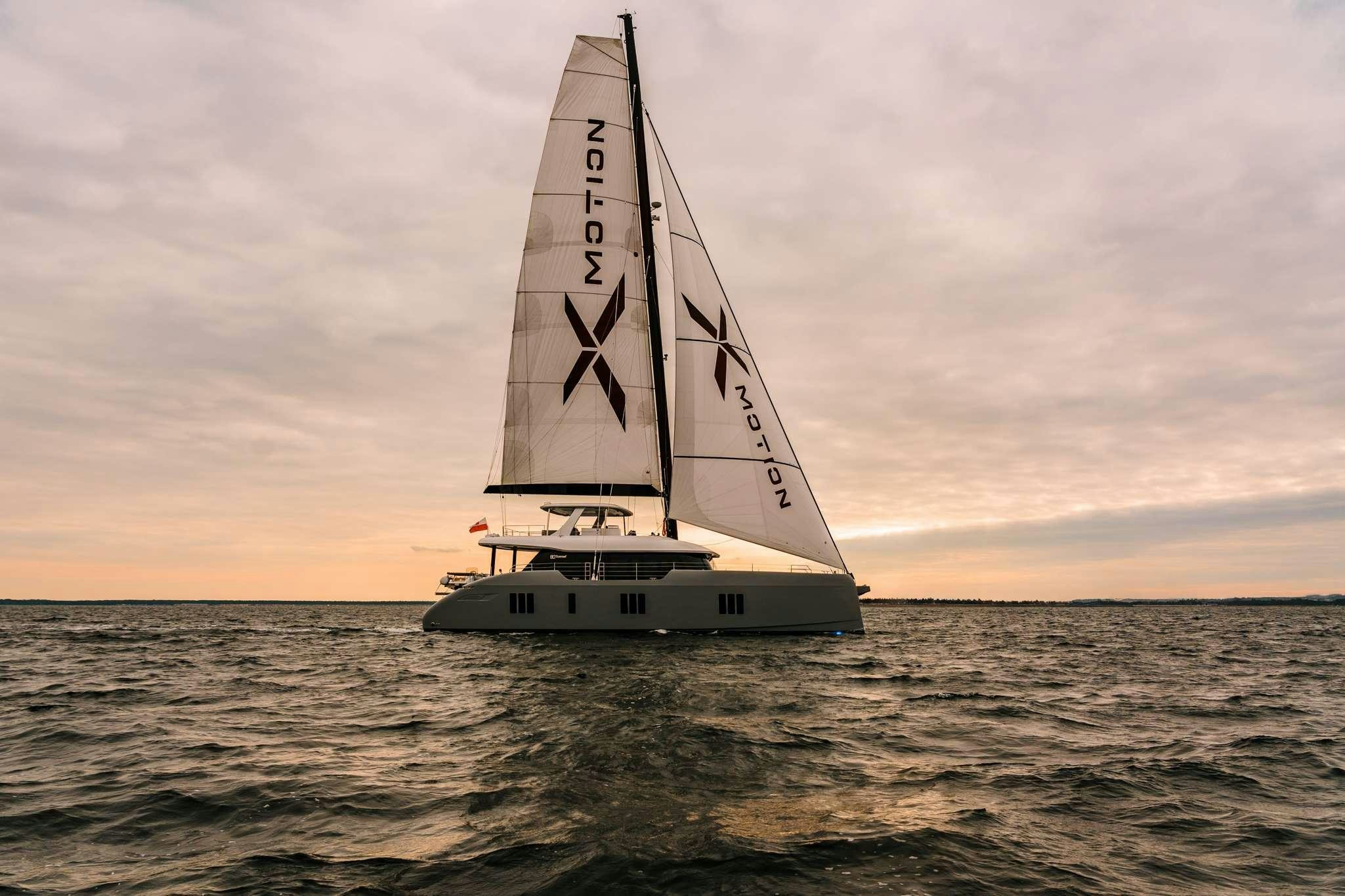 a sailboat in the water aboard XMOTION Yacht for Charter