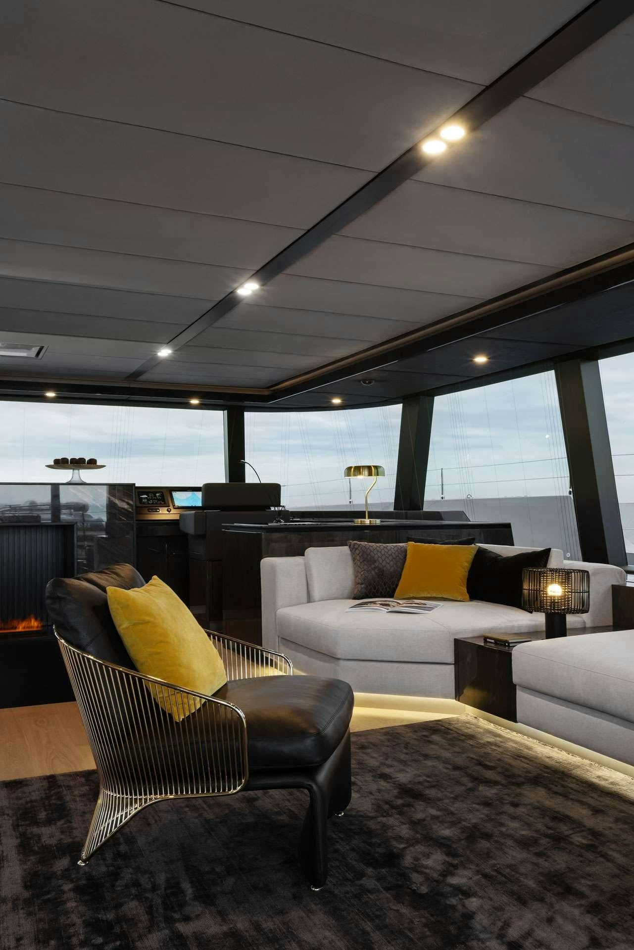 a living room with a large window aboard XMOTION Yacht for Charter