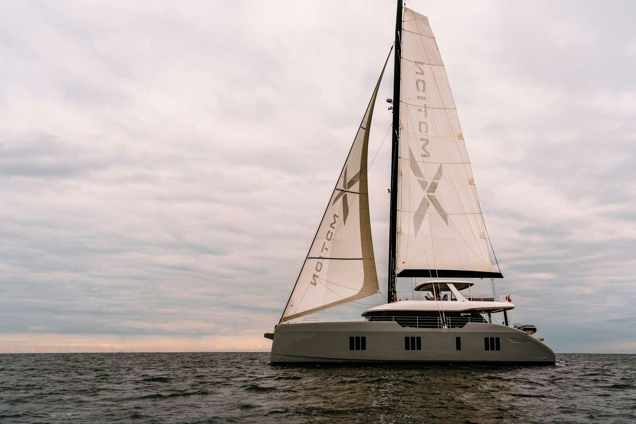 a sailboat in the water aboard XMOTION Yacht for Charter