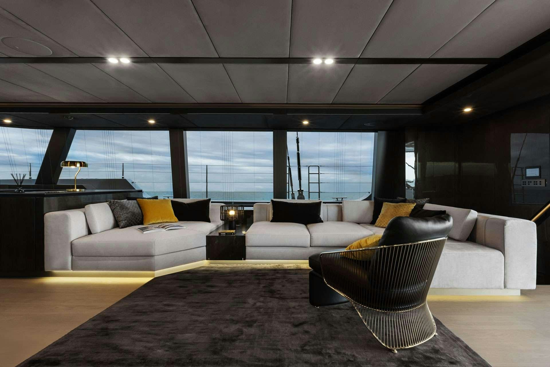 a living room with a large window aboard XMOTION Yacht for Charter
