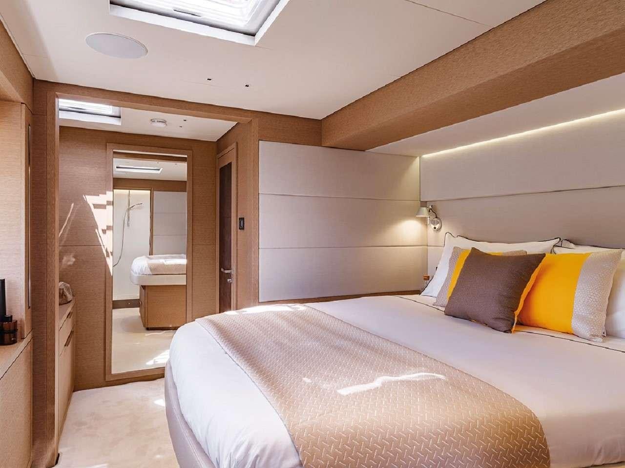 a bed in a room aboard REVE BLEU Yacht for Charter