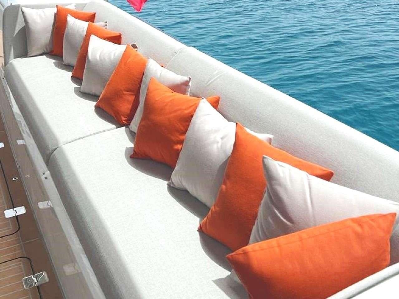 a deck with chairs on it aboard REVE BLEU Yacht for Charter