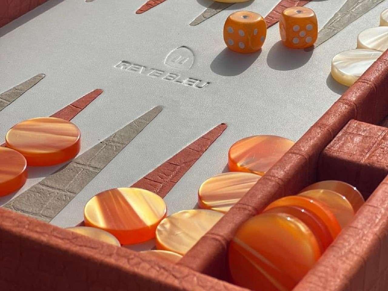 a table with orange and white tiles aboard REVE BLEU Yacht for Charter