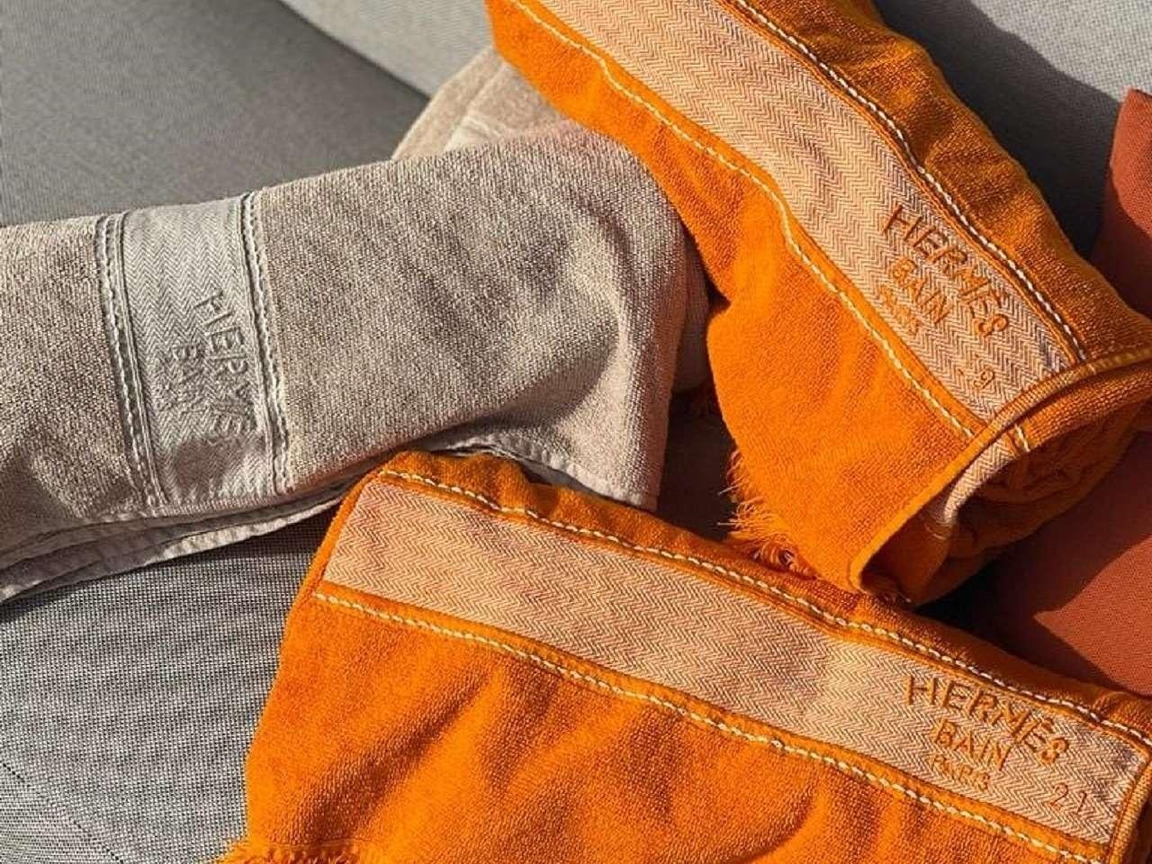 a person wearing a yellow and orange bag aboard REVE BLEU Yacht for Charter