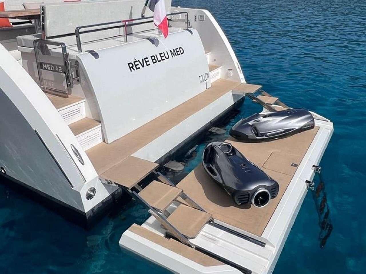 a boat with a laptop on the front aboard REVE BLEU Yacht for Charter