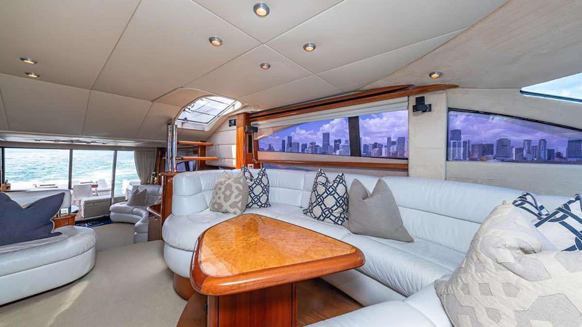 a living room with a couch and a table aboard GIULI Yacht for Charter