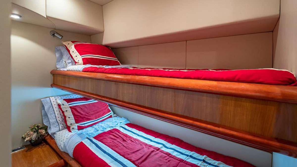 a bed with pillows aboard GIULI Yacht for Charter