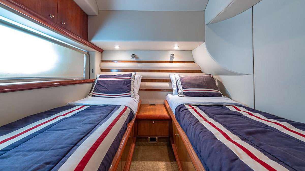 a couple of beds in a room aboard GIULI Yacht for Charter