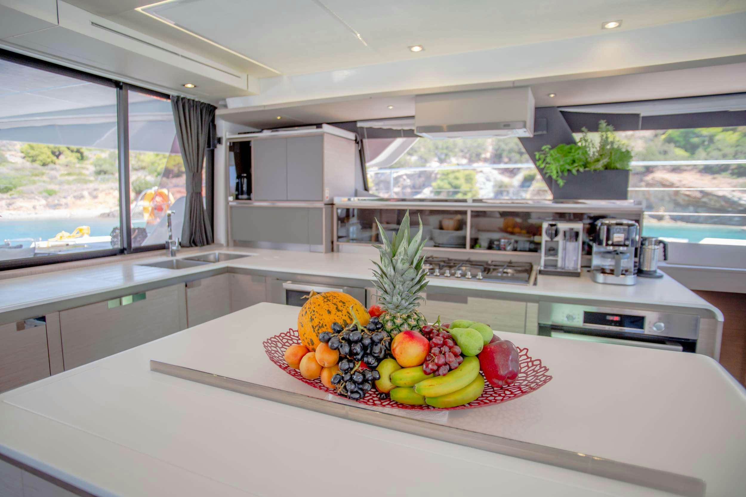 a kitchen with a large island aboard JEWEL Yacht for Charter