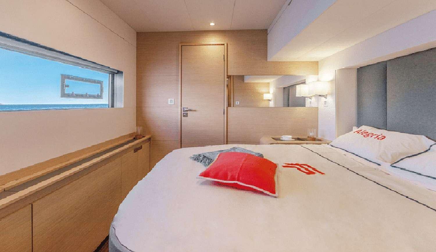 a hotel room with a bed aboard JEWEL Yacht for Charter