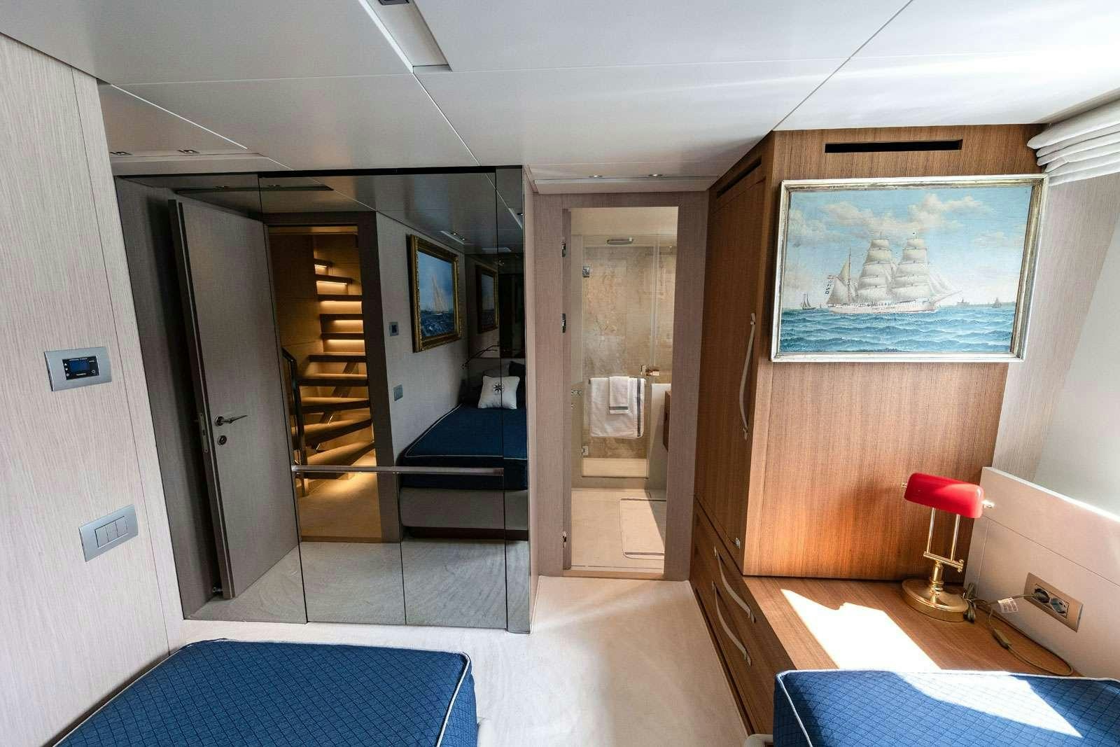 a room with a bed and a door aboard VITTORIA Yacht for Charter