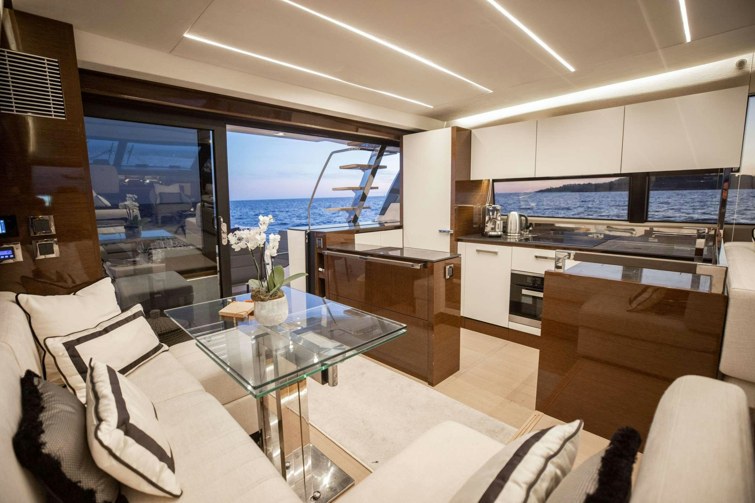 a living room with a large window aboard ROMY ONE Yacht for Charter