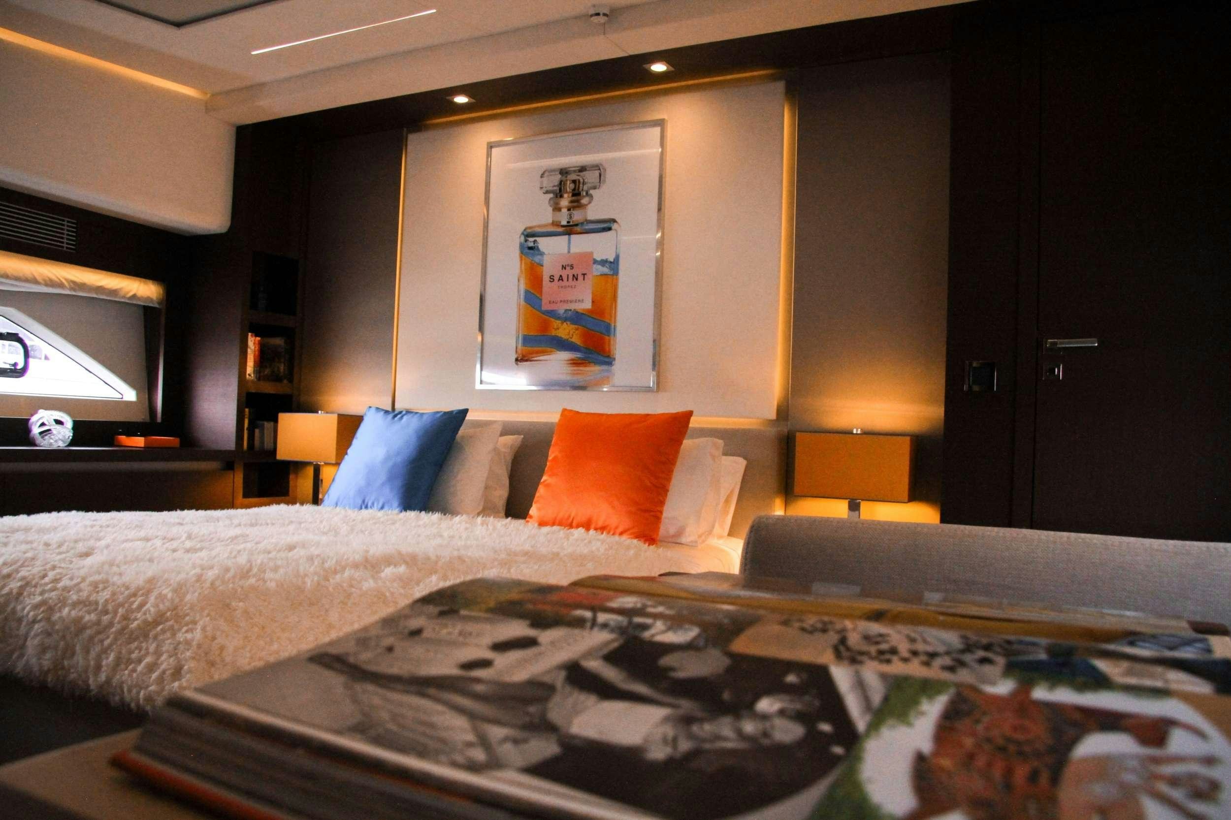 a bed with pillows aboard ROMY ONE Yacht for Charter