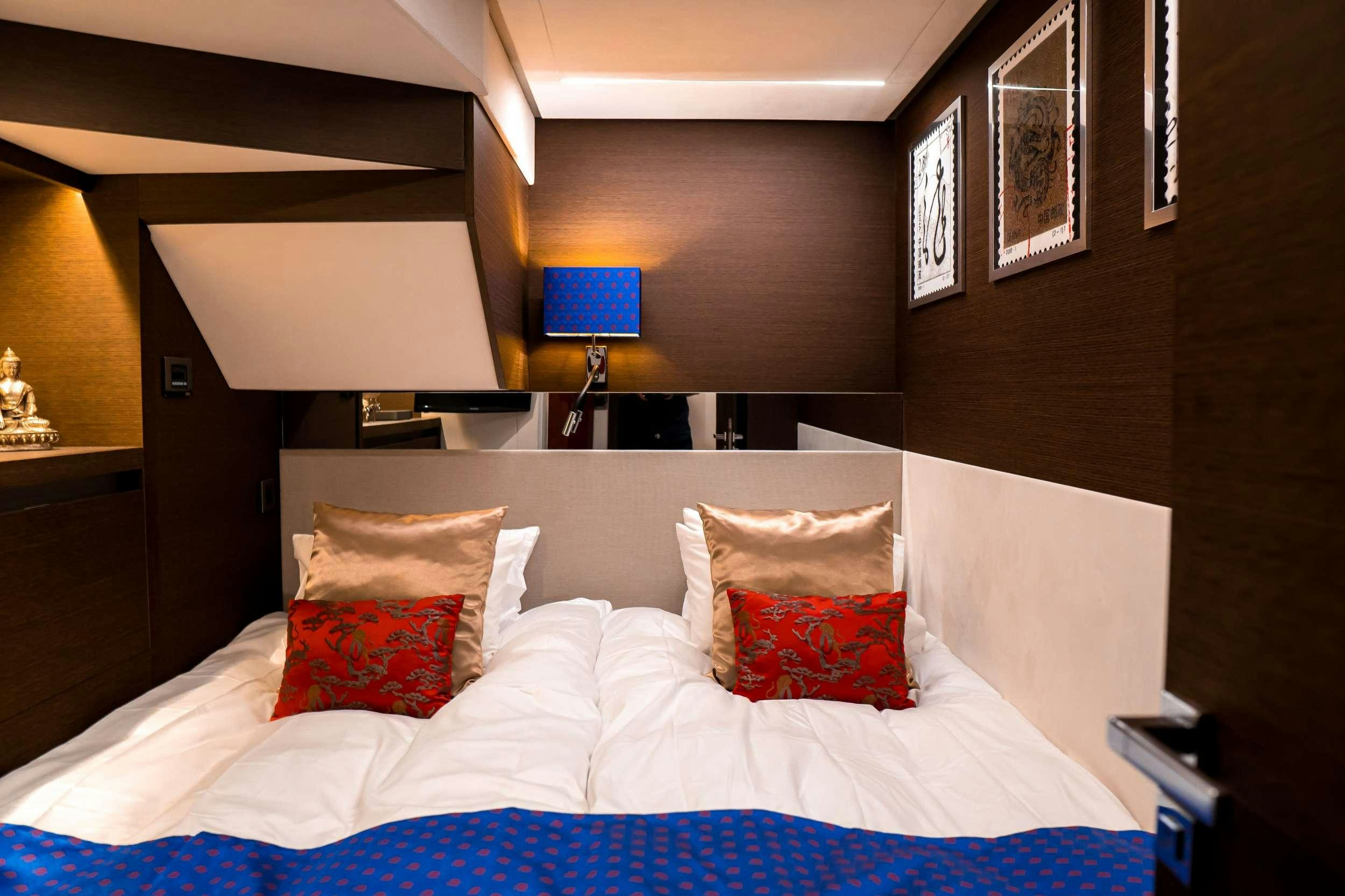 a bed with pillows aboard ROMY ONE Yacht for Charter