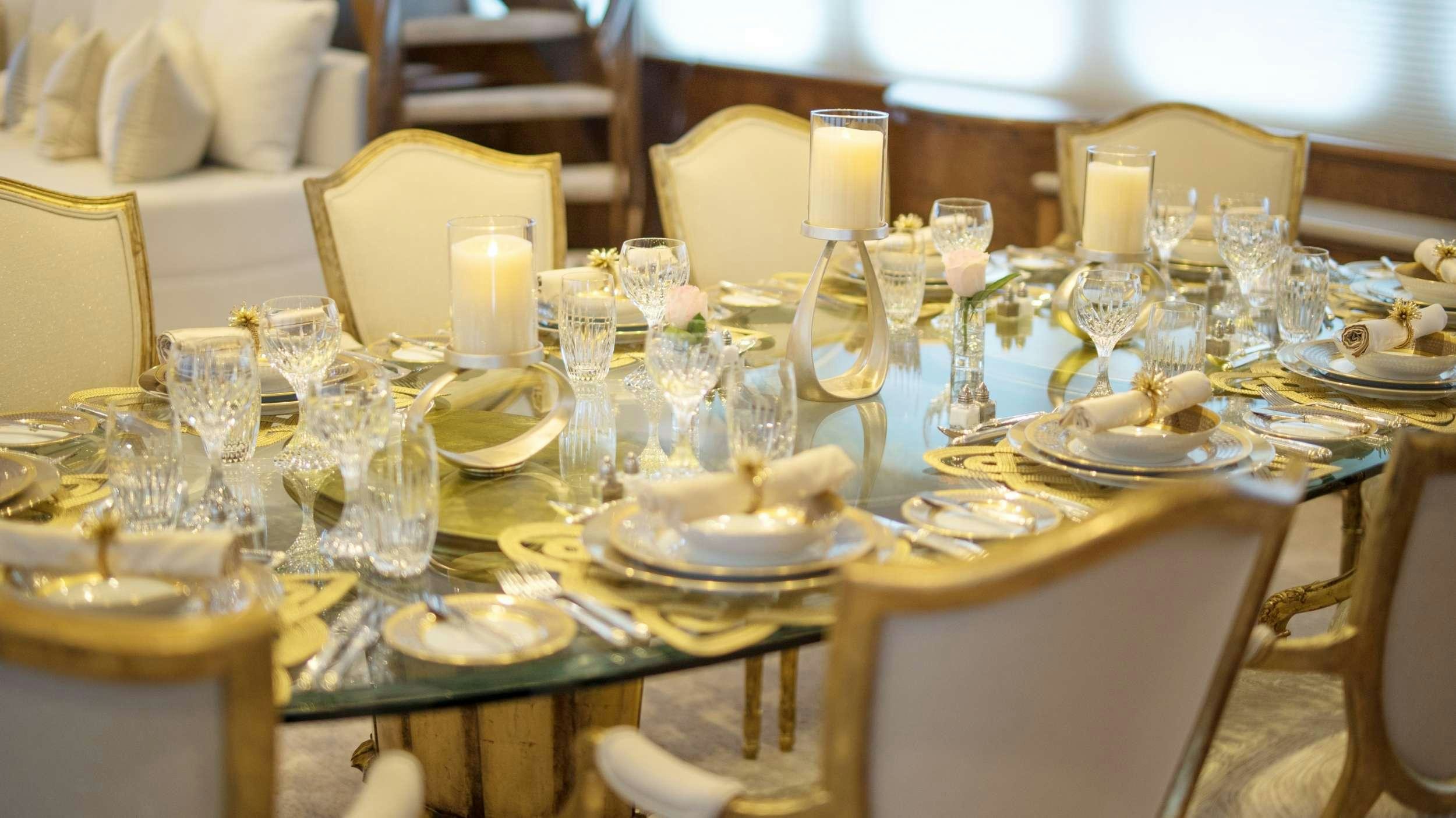 a table set for a dinner aboard GRAND ILLUSION Yacht for Charter