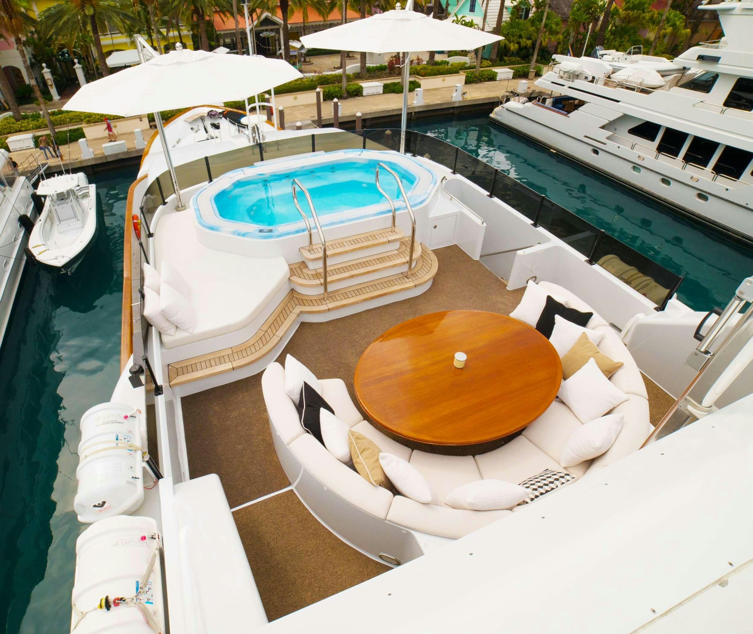 a boat docked at a pier aboard GRAND ILLUSION Yacht for Charter