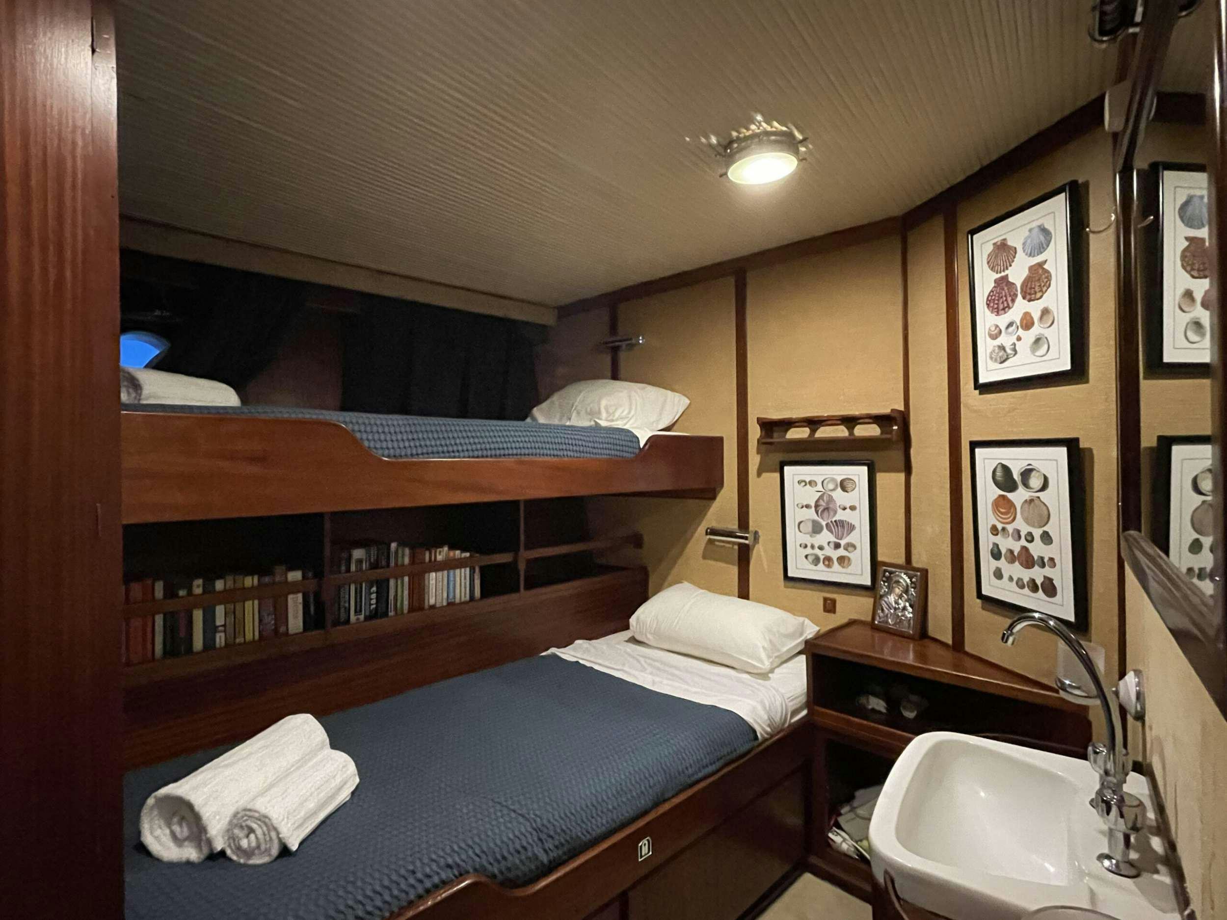 a bed in a room aboard APHRODITE Yacht for Charter