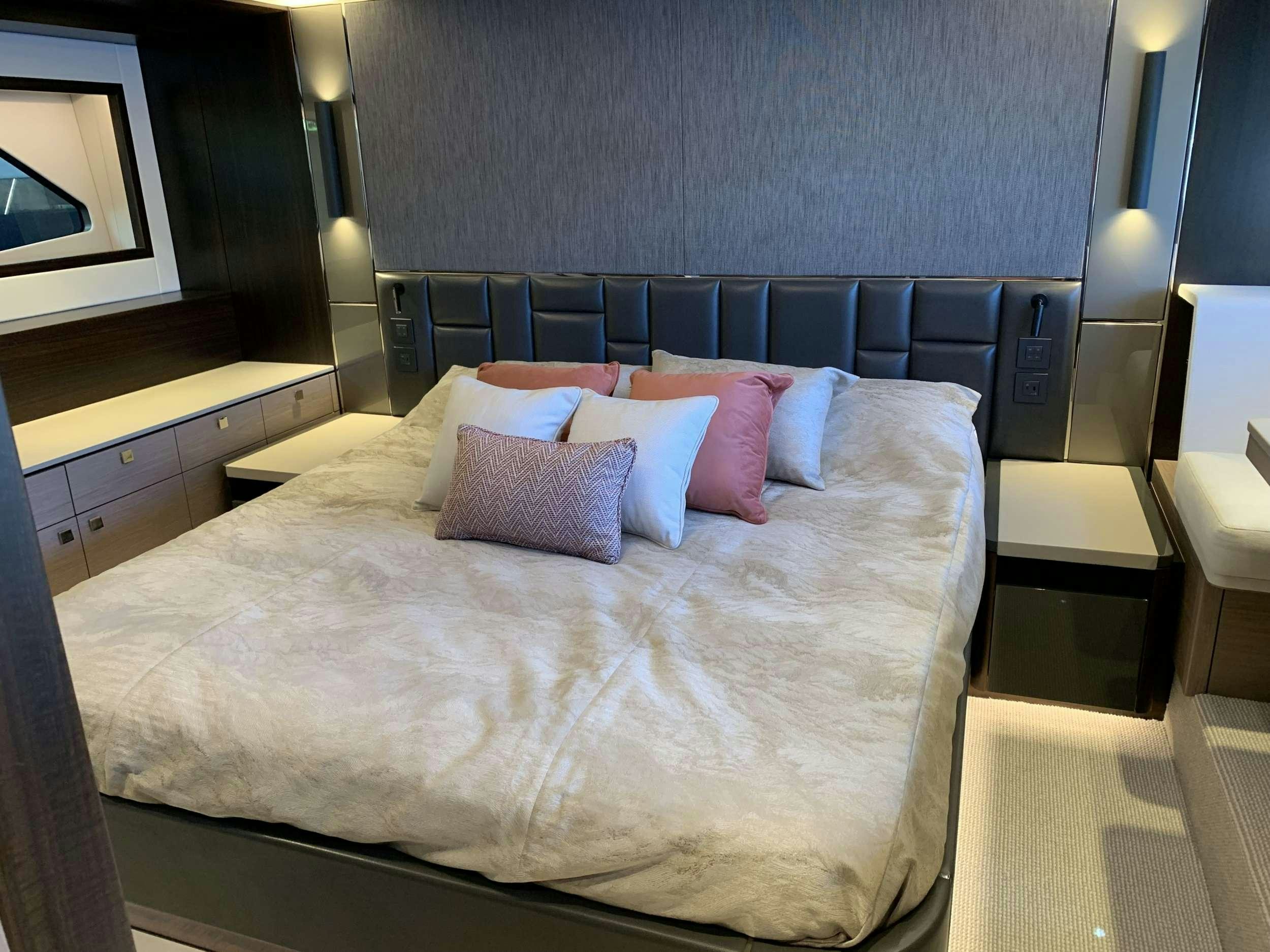 a bed with pillows aboard EARL GREY Yacht for Charter